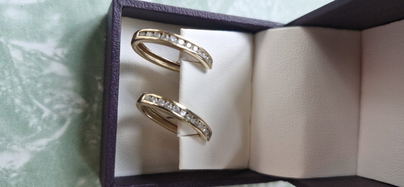 Gold and diamond huggie earrings Carousel 1