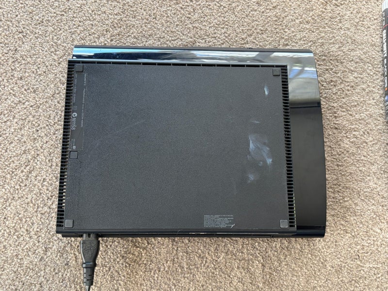 PS3 Super Slim 500 GB, Dual Shock Controllers, Games Carousel 9