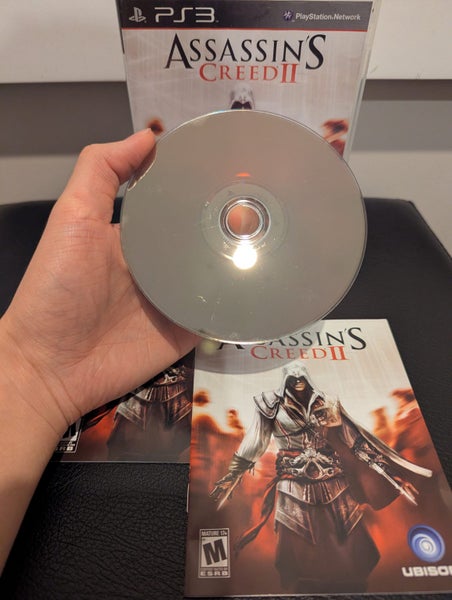 PS3 Slim 320GB (CECH-2502B) Boxed | 2 Controllers + Assassin’s Creed II Carousel 10