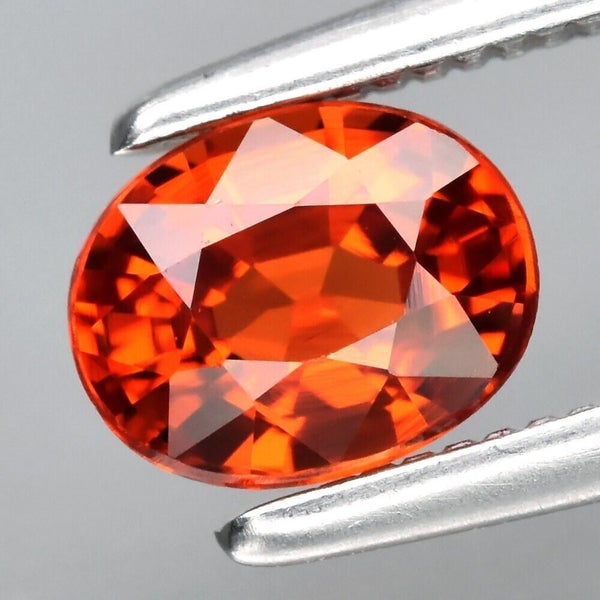 $1 RES * Buy Now $899.00 * 0.67ct Oval Orange VS Garnet Loose Gemstone Carousel 1