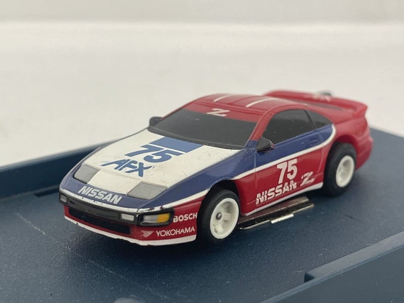 AFX TOMY NISSAN 300ZX #75 SLOT CAR Carousel 1