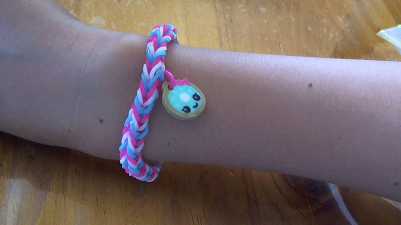 Pink, blue and white loom band bracelet with doughnut charm Carousel 2