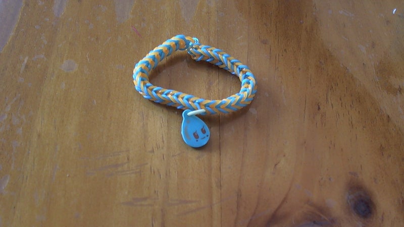 Blue and orange loom band bracelet with water drop charm Carousel 1