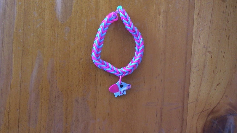 Pink and blue loom band bracelet with dino charm Carousel 1