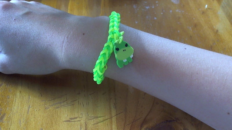 Green and yellow loom band bracelet with hippo charm Carousel 2