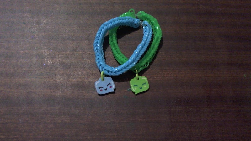 Friendship bracelet, blue and green with text bubble charm Carousel 1