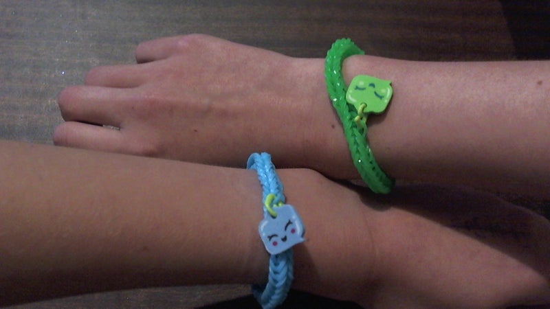 Friendship bracelet, blue and green with text bubble charm Carousel 2