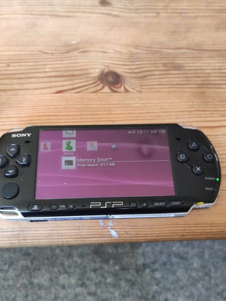 Working PSP 2002 Slim (with charger), four games and a case. Carousel 3