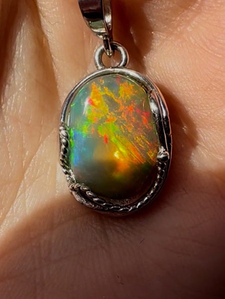 Natural Ethiopian Opal Pendant in Sterling Silver setting and chain Carousel 1