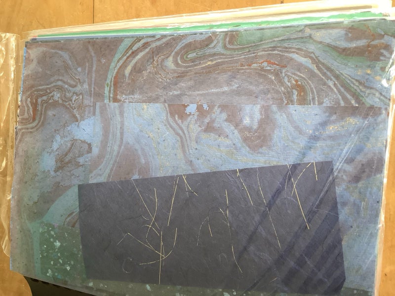 Bulk scrapbook paper, Embelishments and some instruction manuals Carousel 1