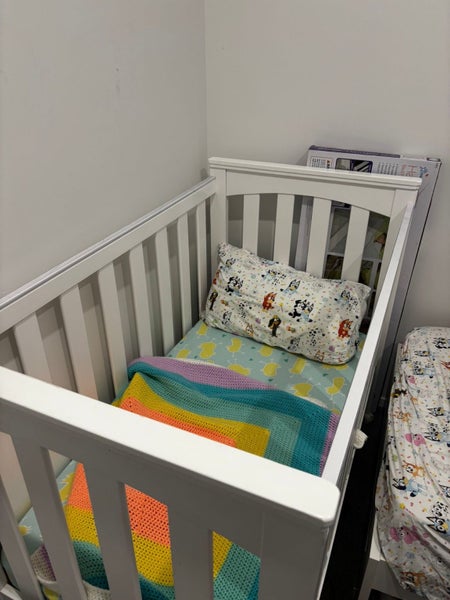 White wooden cot Carousel 1