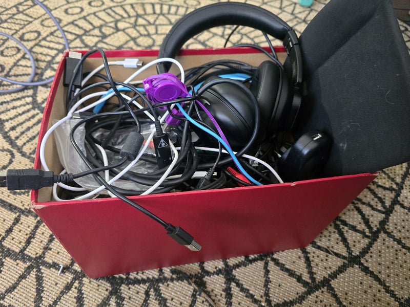 box of random cords and headphones Carousel 1