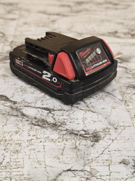 *1$ FAULTY AUCTION* Milwaukee 2.0AH Battery Carousel 1