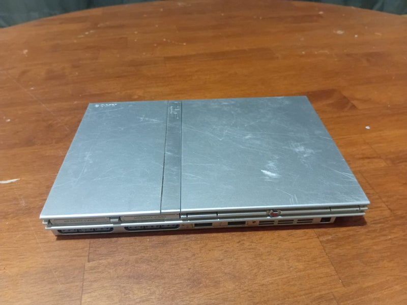 Playstation 2 satin silver slim and accesories Carousel 1