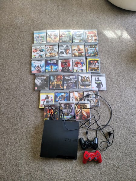 Play Station 3 with games and 2 x controllers 26 games Carousel 1