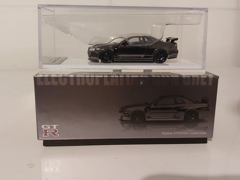 Motorhelix Nissan Skyline GT-R R34 Nismo Electro. Gun Metal - Limited Edition Carousel 1