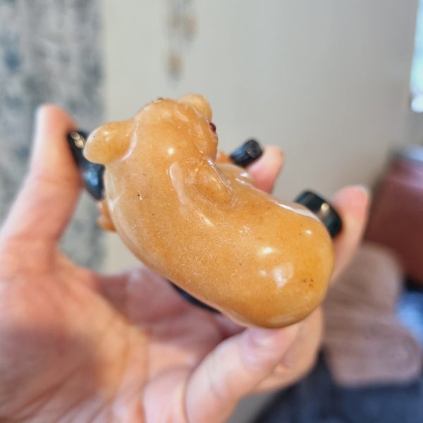 An orange Jasper jade bear on dark green jade branch Carousel 2