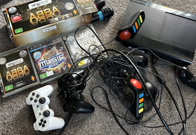 PS3 plus Buzz & Singstar Abba & Queen Carousel 1