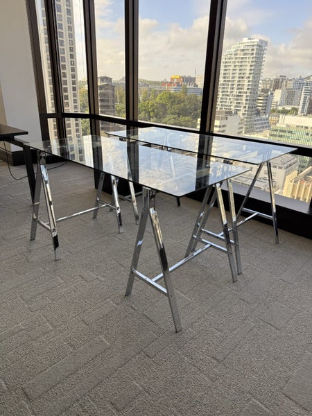One Modern glass office desk on chrome trestle legs Carousel 1