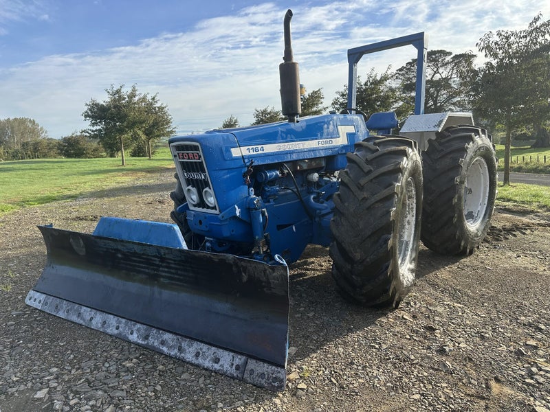 Ford County 1164 tractor with 3-axis hydraulic blade