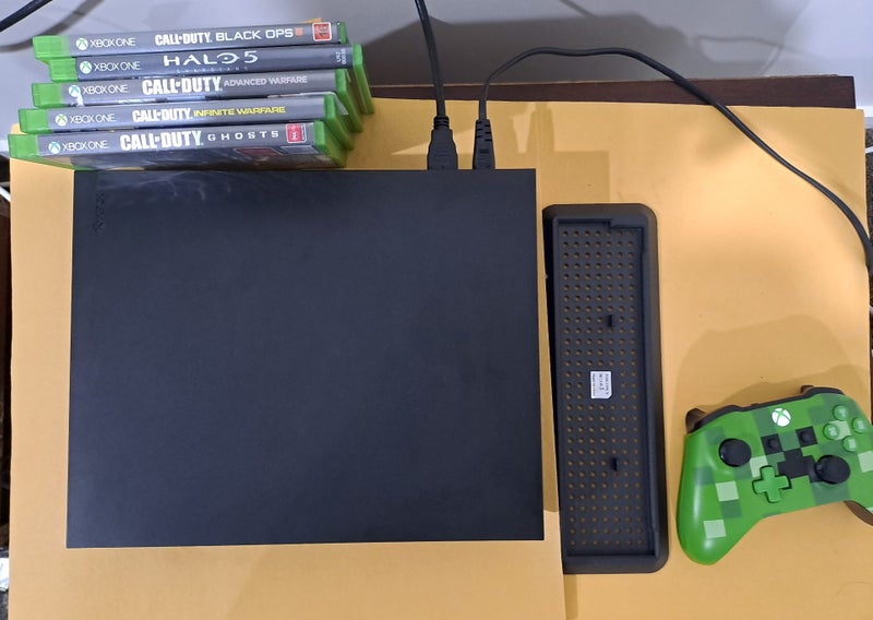 xbox One X 1 TB console green controller and 5 games and a vertical stand Carousel 1