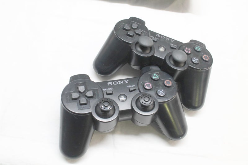 PS3 Slim, 20 Cool Games & Controllers Carousel 2