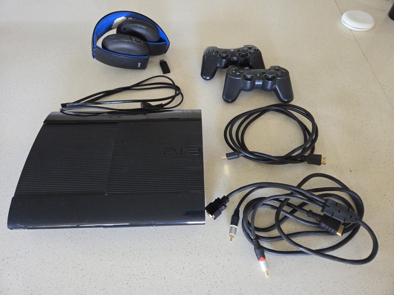 Sony PlayStation 3 Super Slim + controllers and games Carousel 1
