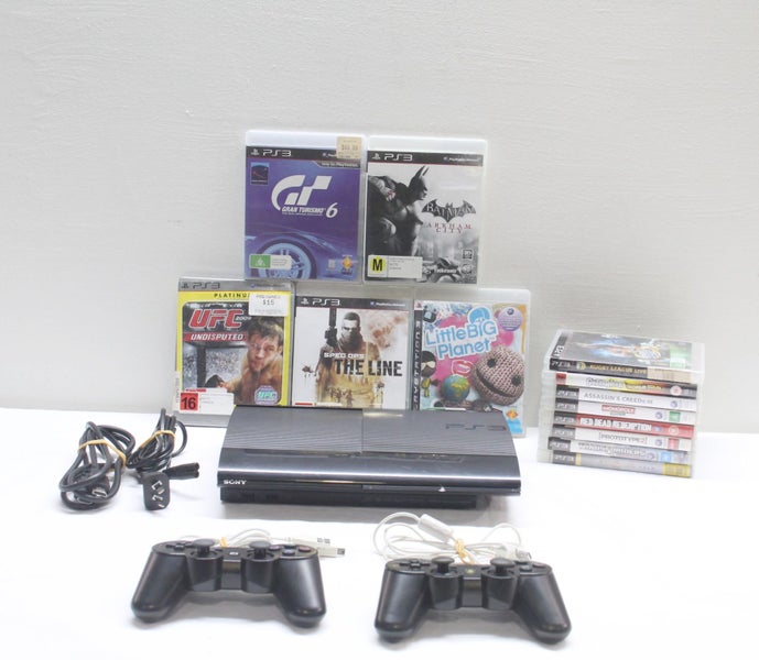 PS3 Slim, 12 Cool Games & Controllers Carousel 1