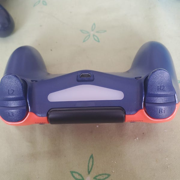 PlayStation 4 DualShock 4 Wireless Controller in the "Sunset Orange" special edi Carousel 1