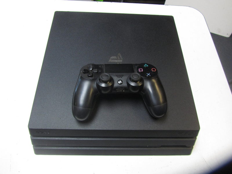 PS4 Pro model CUH-7202B with controller Carousel 1