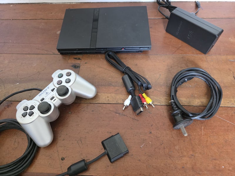 Sony PS2 Slim – PlayStation 2 Slim, Controller and Cables Carousel 1