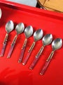 Set of six creative metalwork teaspoons