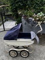 Silver cross style dolls pram and porcelain doll