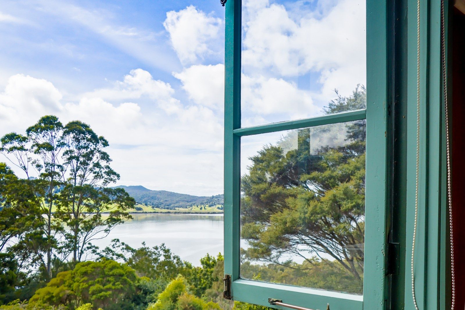 Elevated coastal living with harbour views — slide 1