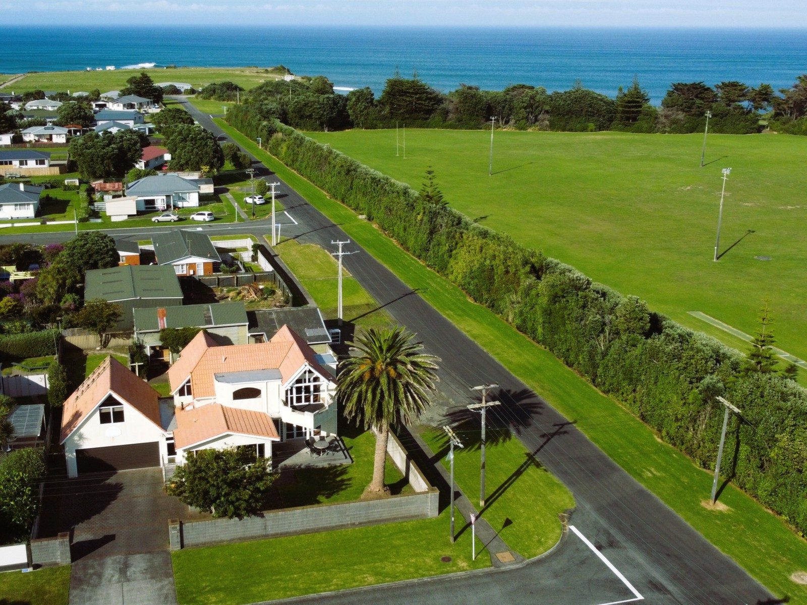UNIQUE COASTAL PROPERTY WITH GARAGING GALORE — slide 1