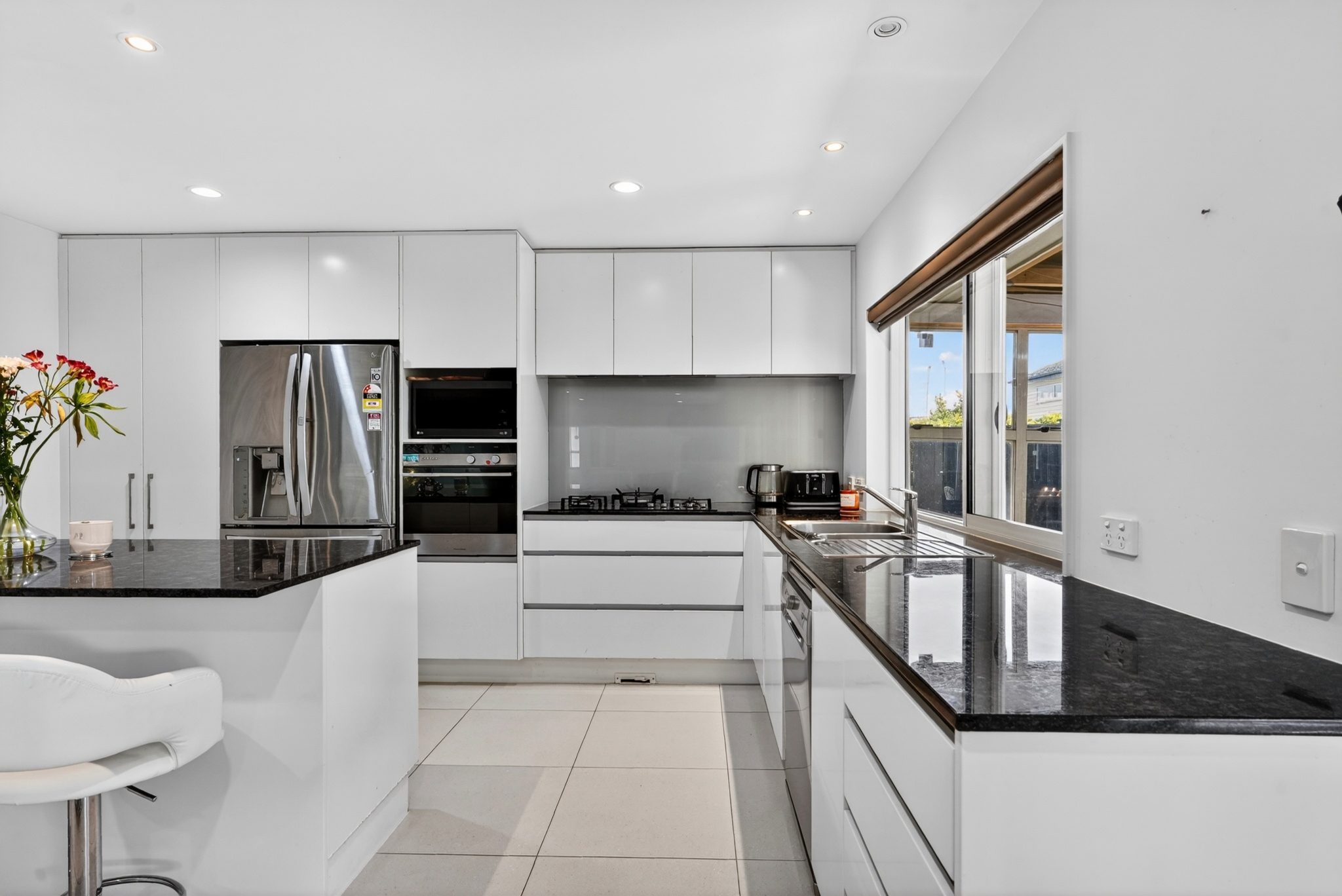 Spacious Abode with Triple Garaging — slide 2