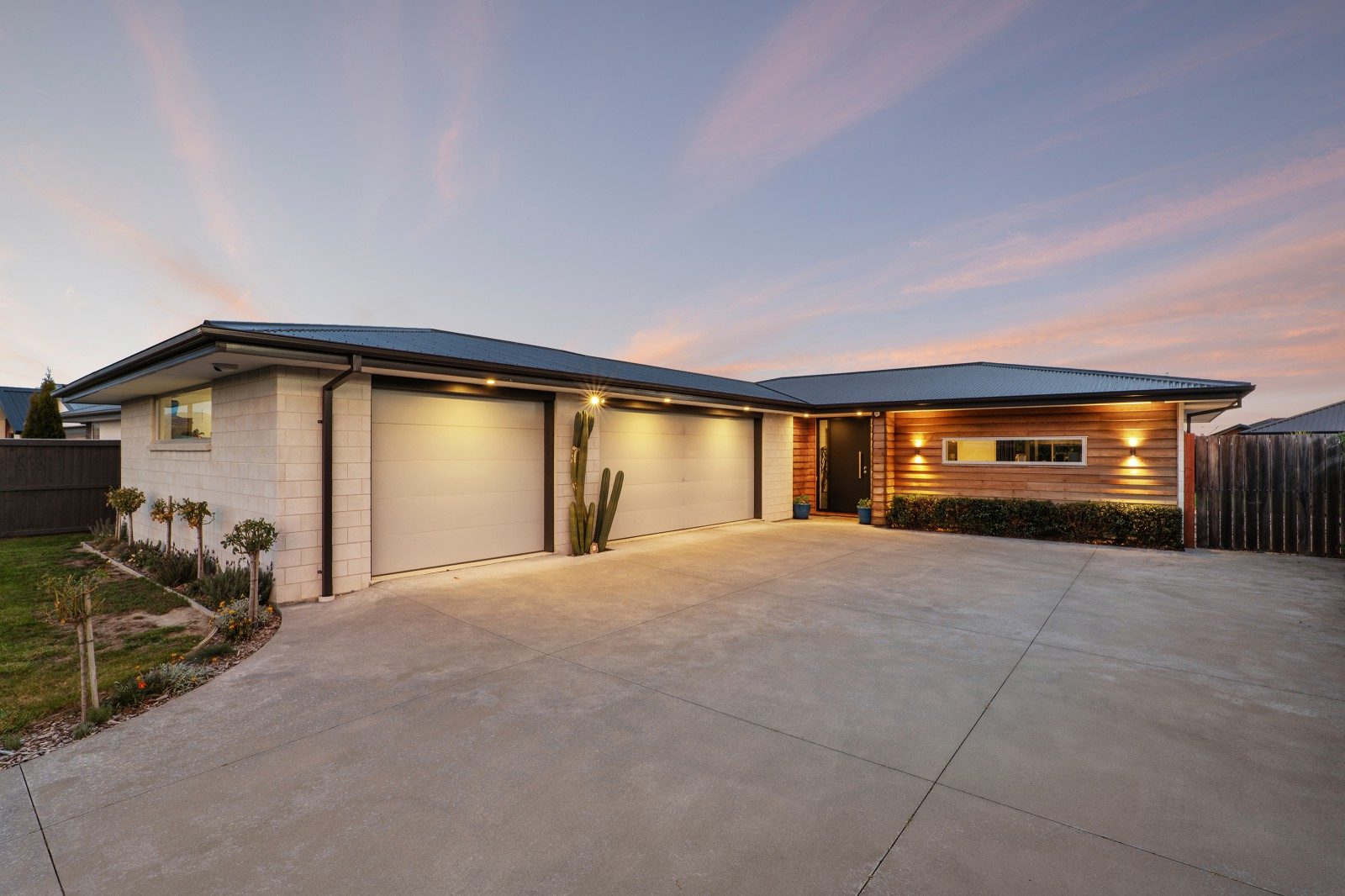 Triple garage, three bedrooms, top-tier living — slide 2