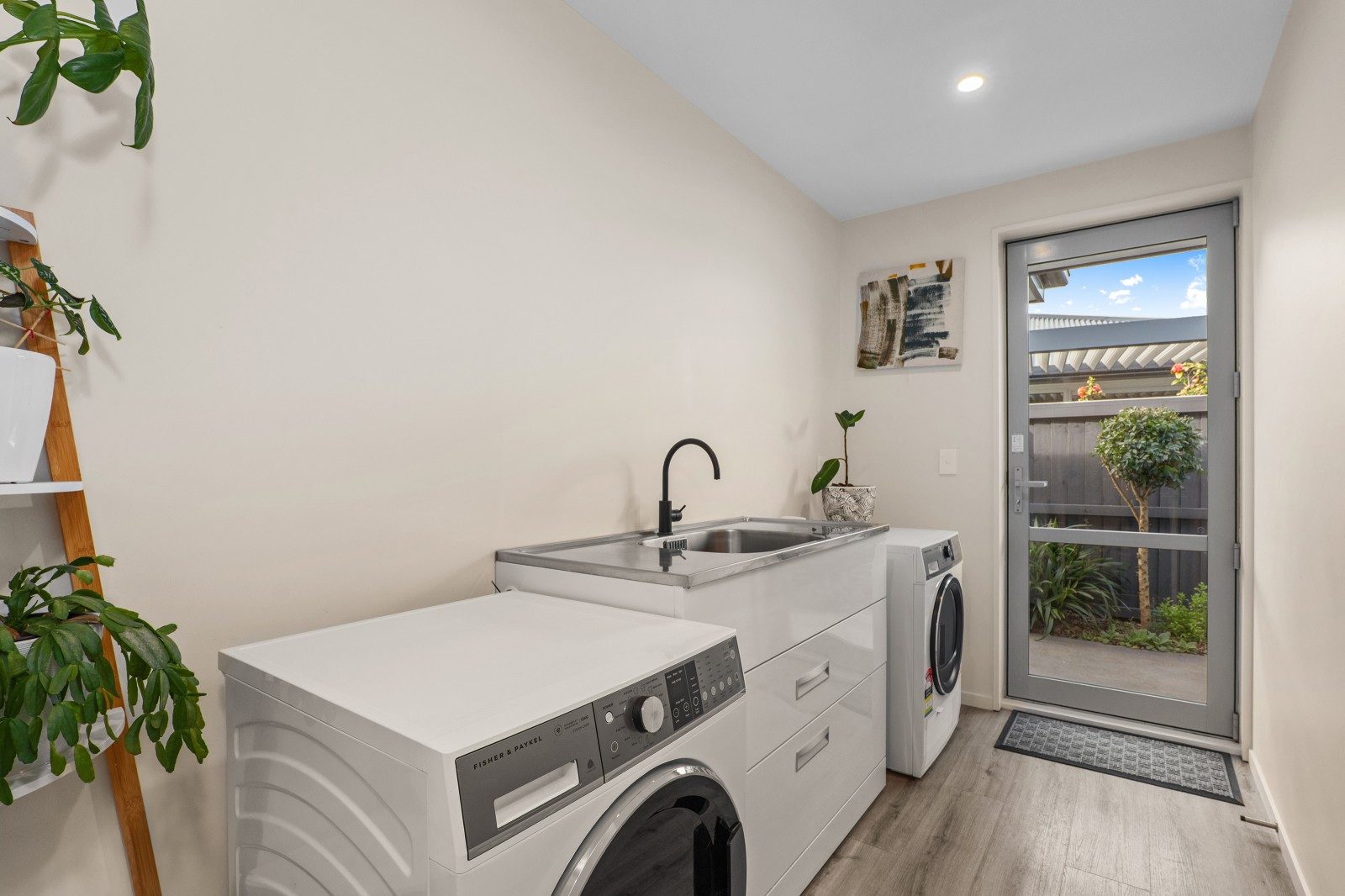 Triple garage, three bedrooms, top-tier living — slide 22