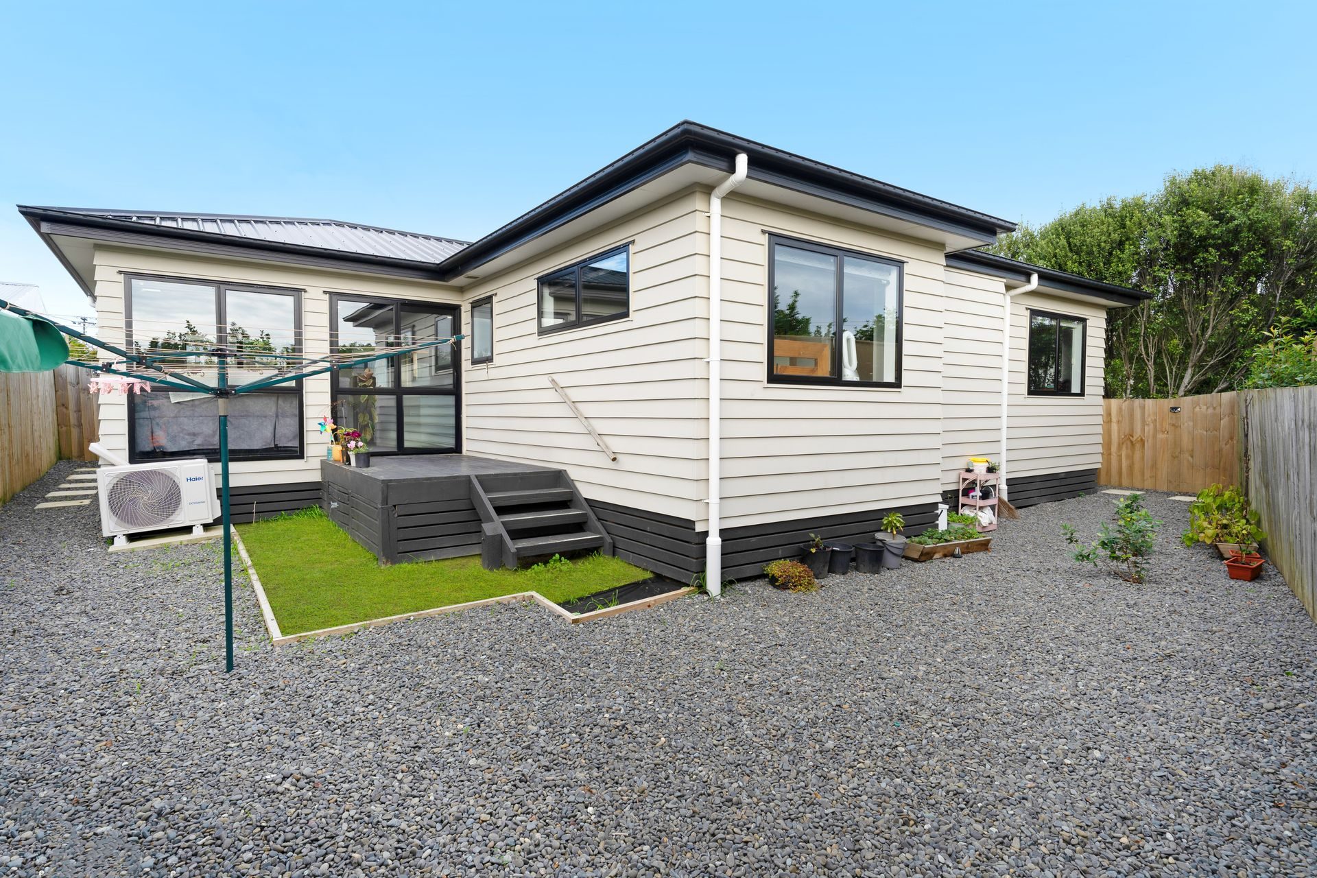 ## Modern, Near-New Standalone Living! — slide 1