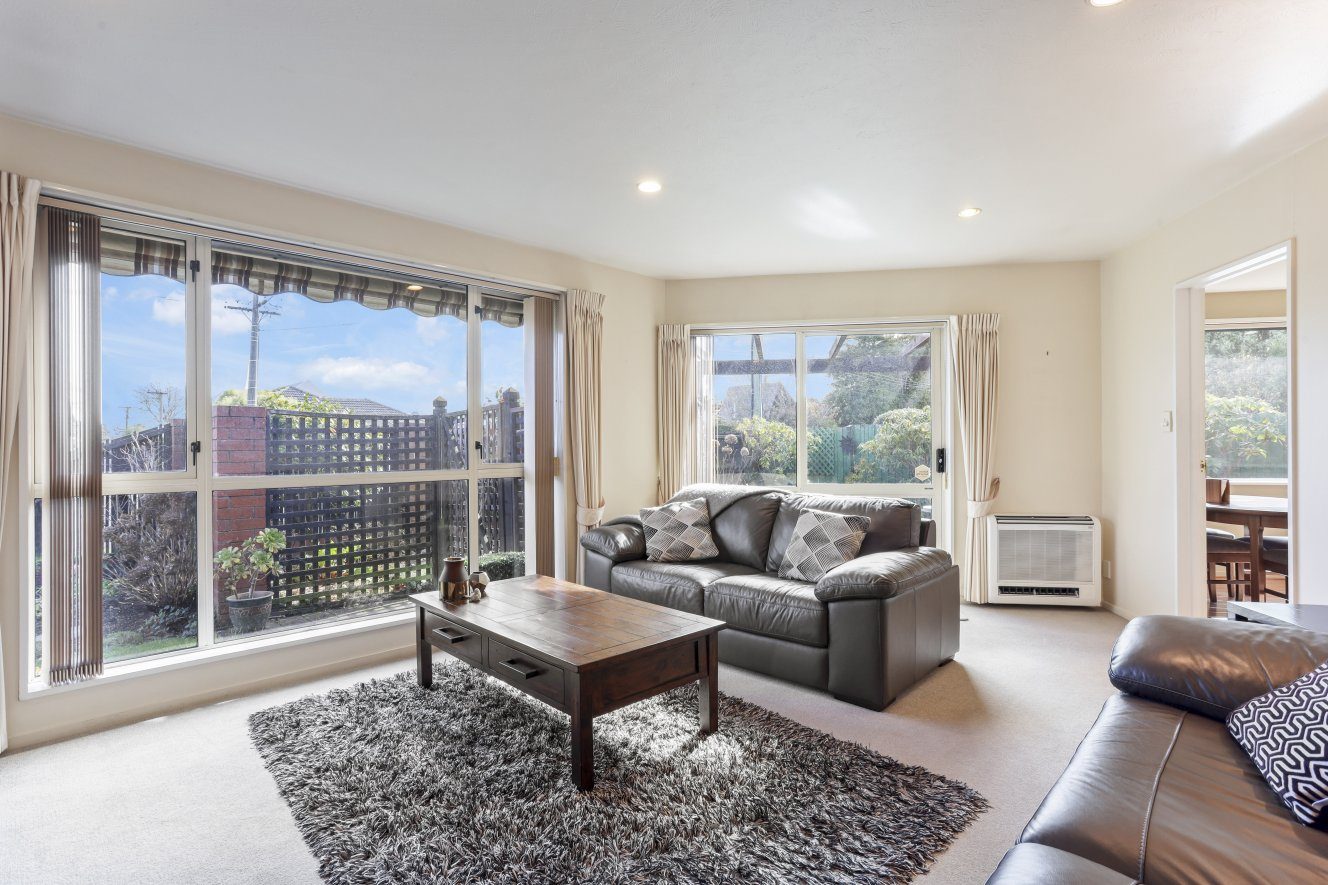Sunny And Spacious With Double Garaging! — slide 2